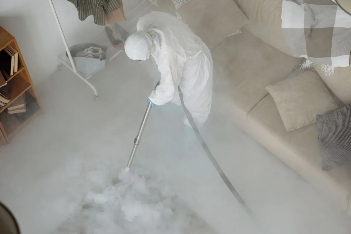 Biohazard cleanup technician in protective equipment, Ignacio, CO